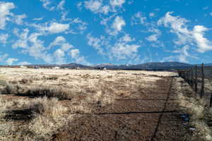 View of mountain background featuring rural landscape