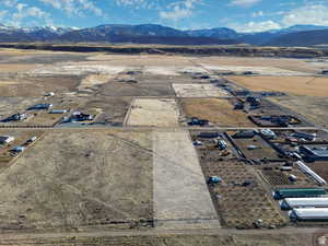 Overview of rural landscape featuring a mountainous background