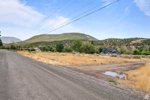 View of mountain background featuring rural landscape