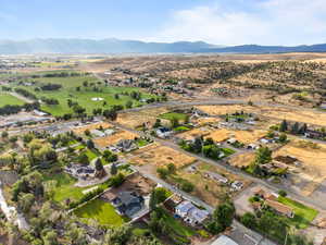 Aerial view of property's location featuring mountains and rural landscape