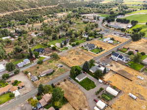 Aerial view of property's location with nearby suburban area