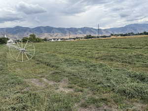 View of mountain background featuring rural landscape