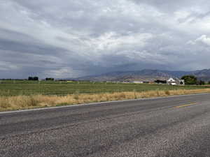 View of mountain background featuring rural landscape