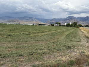 View of mountain backdrop with rural landscape