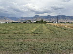 View of mountain backdrop with rural landscape