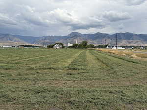 View of mountain backdrop with rural landscape