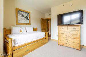 Bedroom with light colored carpet