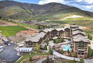 Aerial view of a mountain backdrop and a pool area