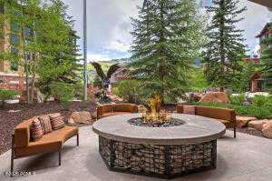 View of patio featuring an outdoor fire pit