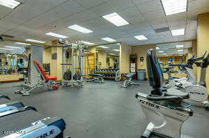 Gym with a paneled ceiling