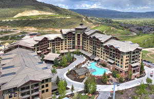 Aerial view of a pool area and a mountain backdrop