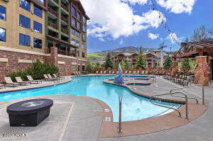 Community pool with a patio area