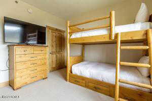 Bedroom with light carpet