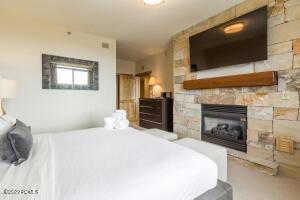 Bedroom featuring a fireplace