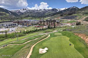 View of property location with a mountain backdrop and a local golf course
