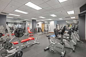 Exercise room with a paneled ceiling