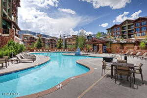 Community pool featuring a patio area