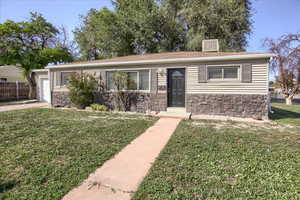 Ranch-style house with stone siding
