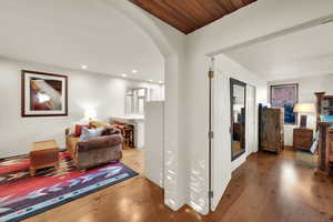 Casita with wood finished floors, arched walkways, and recessed lighting