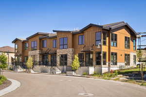 View of front of property featuring stone siding