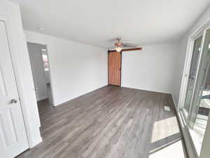 Unfurnished living room featuring light wood-type flooring and a ceiling fan
