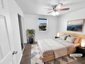 Bedroom featuring wood finished floors and ceiling fan