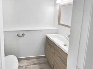 Bathroom with vanity and light wood-style floors