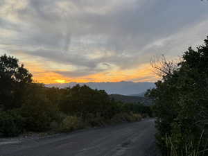 View of dirt / gravel road with a mountain view