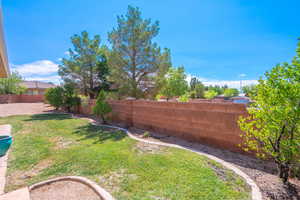 View of fenced backyard
