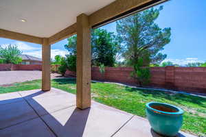 Fenced backyard featuring a patio