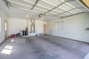 Garage featuring water heater