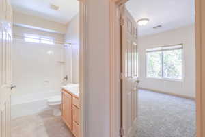 Bathroom with vanity and shower / bathtub combination