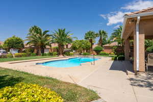 Swimming pool with a patio