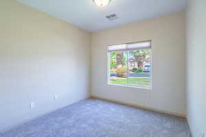 Unfurnished room with carpet flooring