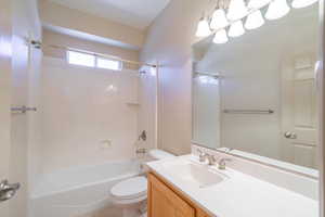 Full bath featuring shower / washtub combination and vanity