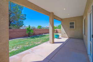 Fenced backyard featuring a patio area