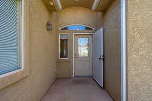 Property entrance with stucco siding