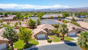 Aerial perspective of suburban area featuring a mountainous background