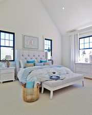 Carpeted bedroom featuring high vaulted ceiling and recessed lighting
