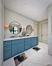 Bathroom with double vanity and recessed lighting