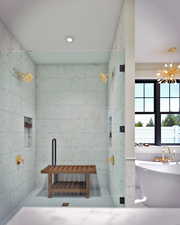 Full bath with tile walls, a tile shower, a freestanding bath, and recessed lighting