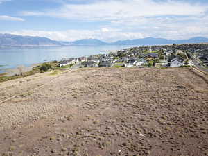 Aerial view of residential area featuring a water and mountain view