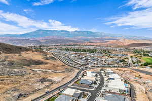 Aerial view of residential area featuring a mountainous background