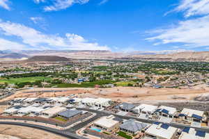 Aerial perspective of suburban area featuring a mountainous background