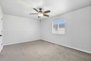 Upstairs Bedroom 2 with ceiling fan and blinds