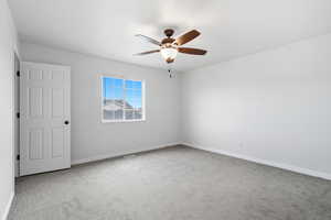 Upstairs bedroom with walk in closet, attached jack-n-jill full bathroom, ceiling fan, blinds, carpeted
