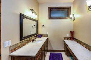 Bathroom featuring vanity and light tile patterned flooring