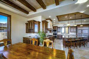 Dining space featuring healthy amount of natural light and beamed ceiling