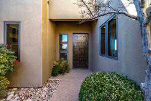 Doorway to property with stucco siding