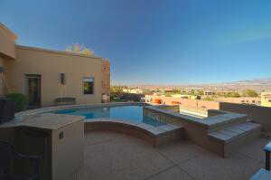 View of swimming pool with a patio area and a jacuzzi